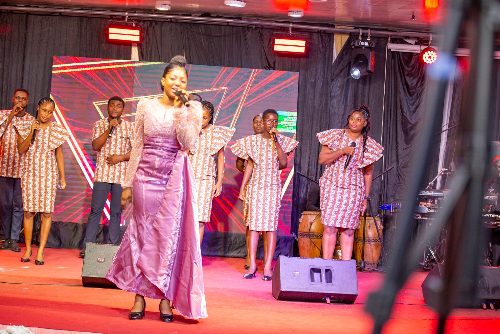 Emily leading worship on stage
